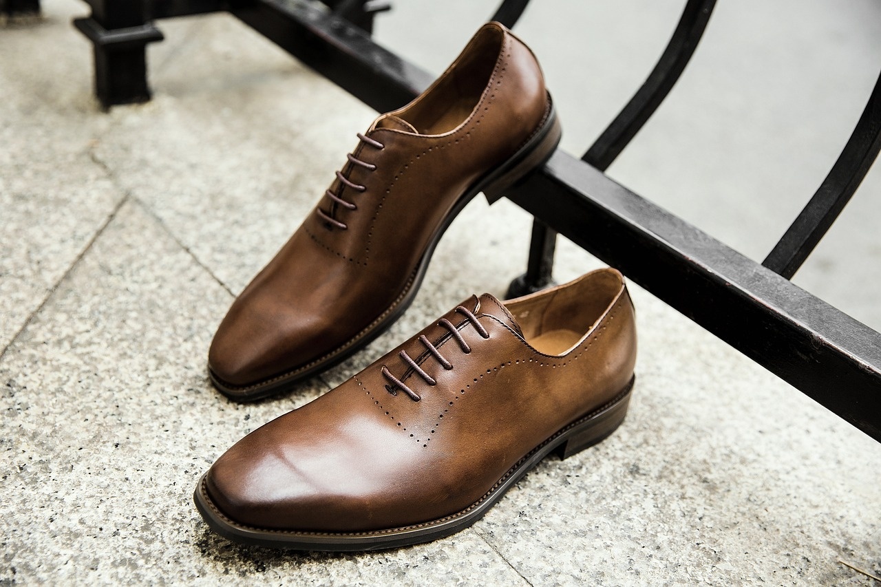 Polished cognac brown leather oxford shoes after professional restoration